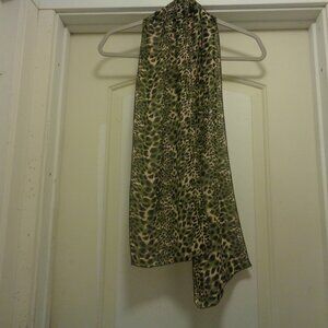 TRENDING OLIVE ANIMAL SCARF W A CREAMY BACKGROUND